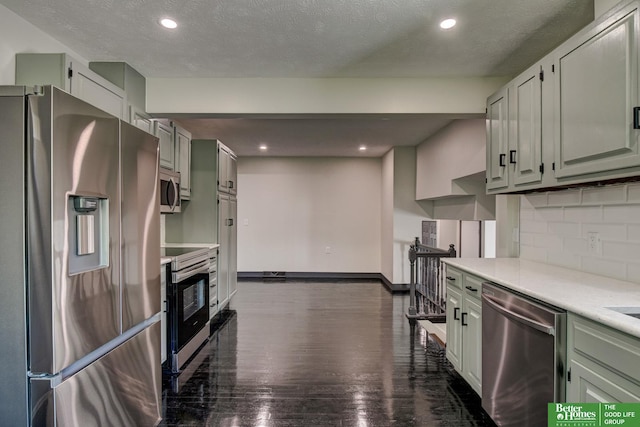 11680 Meredith Ave, Omaha, NE 68164 - kitchen with stainless steel appliances, tasteful backsplash, baseboards, recessed lighting, and light countertops