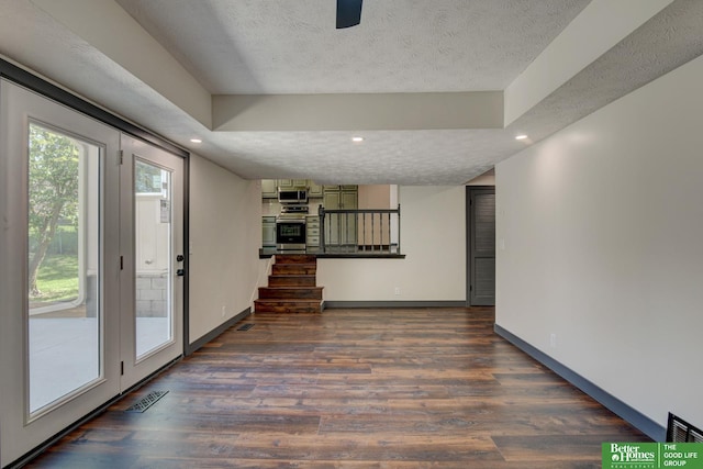 11680 Meredith Ave, Omaha, NE 68164 - unfurnished living room featuring dark wood-style floors, a textured ceiling, stairs, recessed lighting, and baseboards