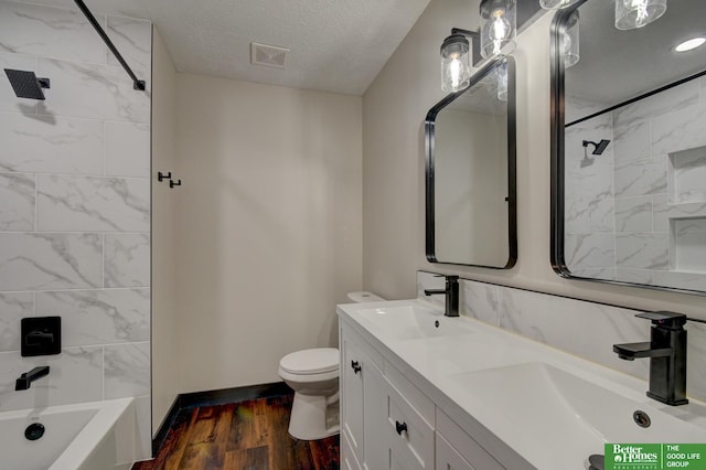 11680 Meredith Ave, Omaha, NE 68164 - bathroom with wood finished floors, toilet, double vanity, baseboards, and tub / shower combination