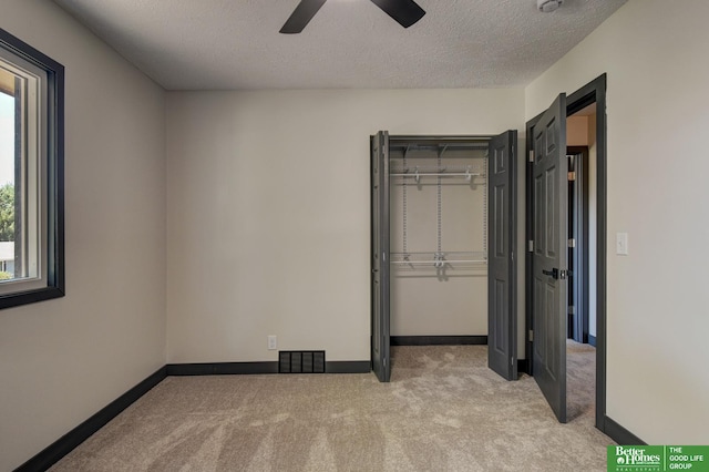 11680 Meredith Ave, Omaha, NE 68164 - unfurnished bedroom featuring carpet, a closet, a textured ceiling, and baseboards