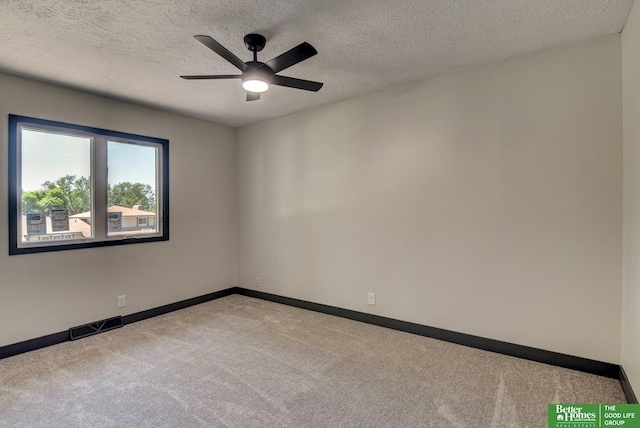 11680 Meredith Ave, Omaha, NE 68164 - carpeted empty room with baseboards, ceiling fan, and a textured ceiling