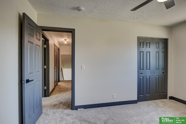 11680 Meredith Ave, Omaha, NE 68164 - unfurnished bedroom with a textured ceiling, carpet, baseboards, a closet, and ceiling fan