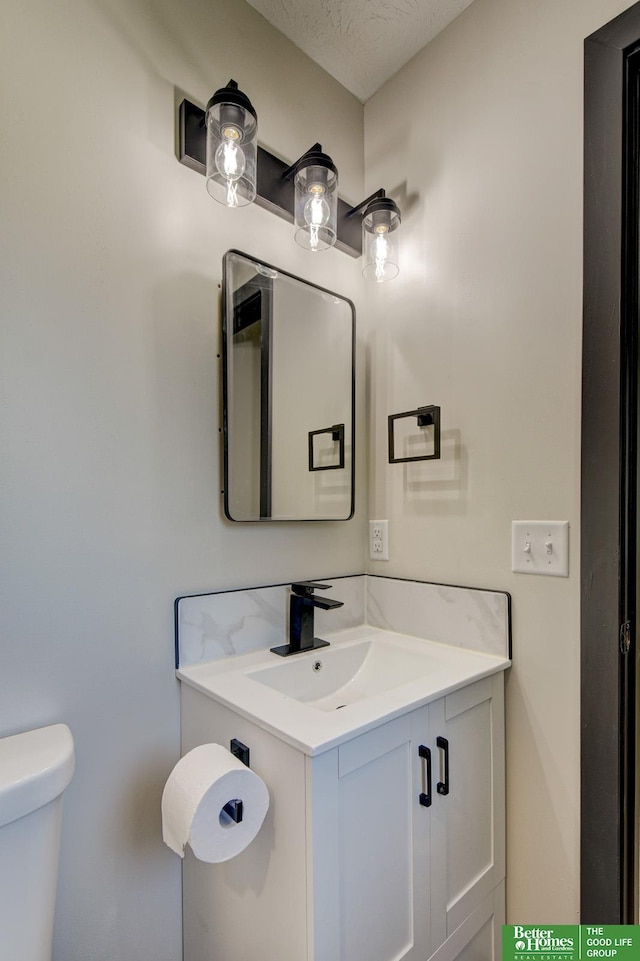 11680 Meredith Ave, Omaha, NE 68164 - bathroom featuring toilet and vanity