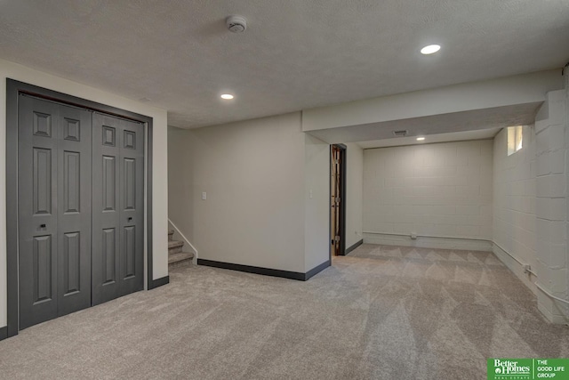 11680 Meredith Ave, Omaha, NE 68164 - finished below grade area with carpet flooring, stairs, concrete block wall, baseboards, and recessed lighting