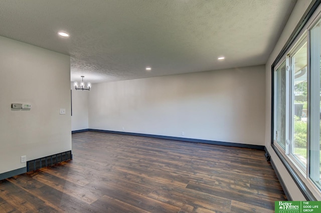 11680 Meredith Ave, Omaha, NE 68164 - spare room with a chandelier, plenty of natural light, dark wood-style floors, baseboards, and recessed lighting