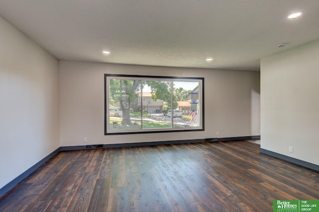11680 Meredith Ave, Omaha, NE 68164 - spare room featuring dark wood-type flooring, baseboards, and recessed lighting
