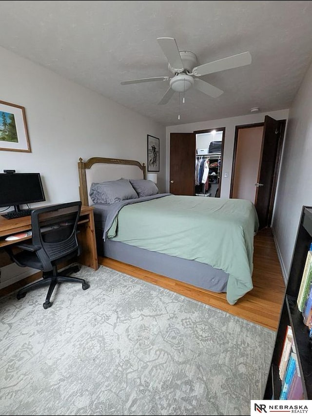 2515 3rd Street Plz, Omaha, NE 68108 - bedroom with wood finished floors, a ceiling fan, and baseboards