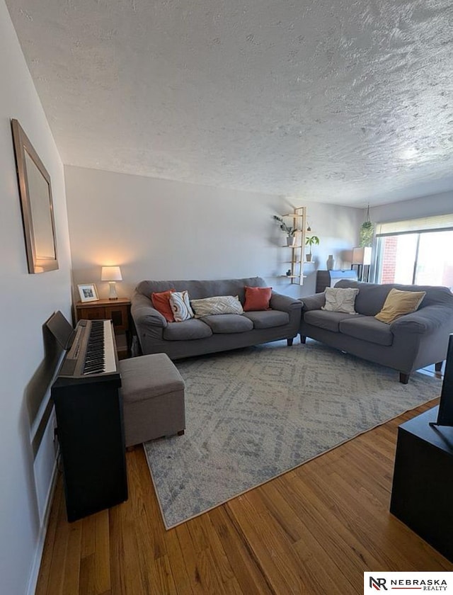 2515 3rd Street Plz, Omaha, NE 68108 - living area with a textured ceiling, wood finished floors, and baseboards