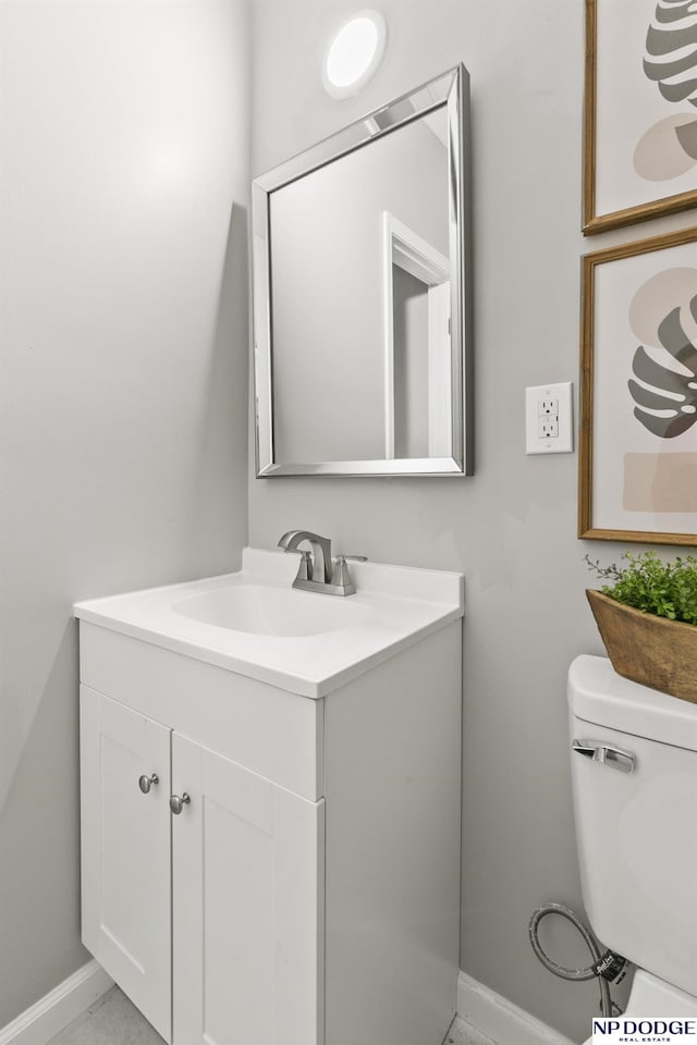 4656 Redick Ave, Omaha, NE 68152 - bathroom with vanity, toilet, and baseboards