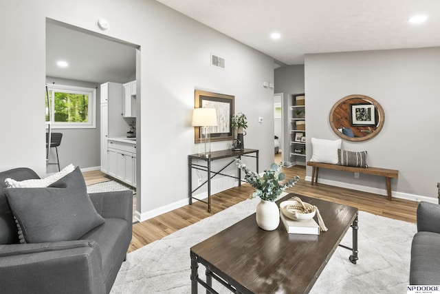 4656 Redick Ave, Omaha, NE 68152 - living room with light wood finished floors, recessed lighting, baseboards, and lofted ceiling