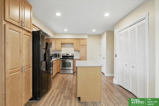 5143 S 126th Plz Unit 22, Omaha, NE 68137 - kitchen with stainless steel appliances, a kitchen island, light brown cabinets, light wood-style flooring, and recessed lighting