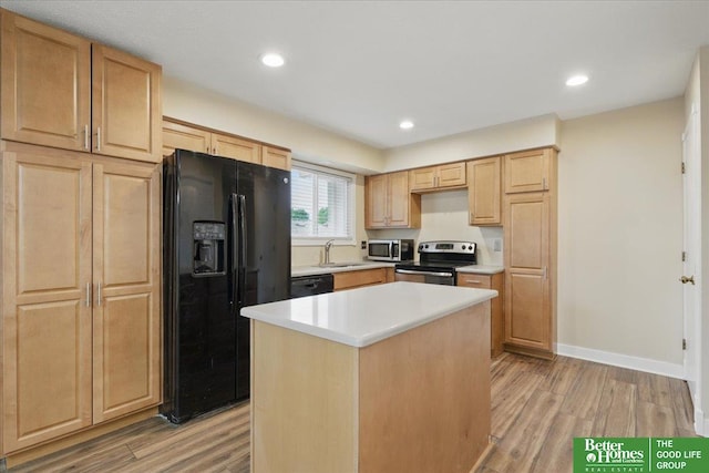 5143 S 126th Plz Unit 22, Omaha, NE 68137 - kitchen with black appliances, light brown cabinetry, light wood-style floors, and recessed lighting