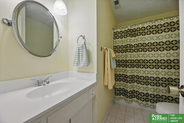 5143 S 126th Plz Unit 22, Omaha, NE 68137 - full bathroom with toilet, tile patterned flooring, vanity, and a shower with shower curtain