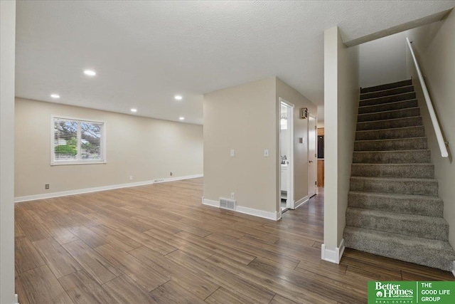 5143 S 126th Plz Unit 22, Omaha, NE 68137 - staircase featuring wood finished floors, baseboards, and recessed lighting