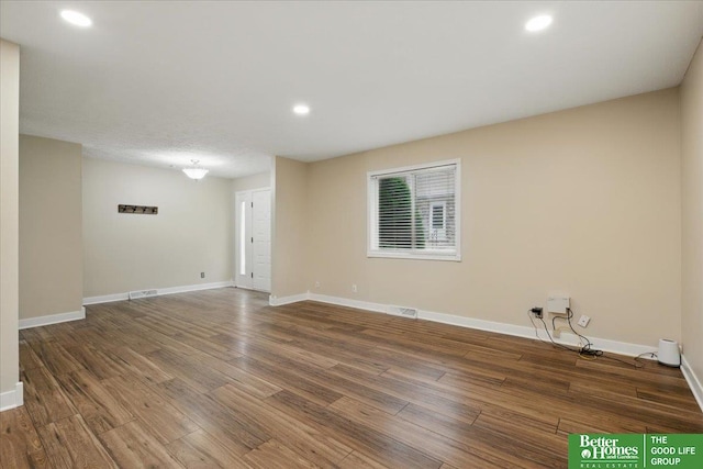 5143 S 126th Plz Unit 22, Omaha, NE 68137 - spare room featuring wood finished floors, baseboards, and recessed lighting