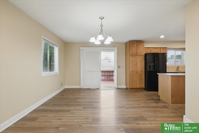5143 S 126th Plz Unit 22, Omaha, NE 68137 - unfurnished dining area with a chandelier, dark wood-style floors, baseboards, and recessed lighting