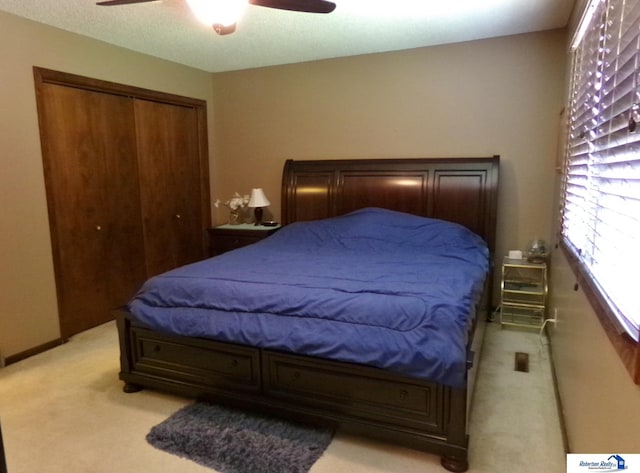1304 S 4th Ave, Beatrice, NE 68310 - bedroom featuring light colored carpet, a closet, and a ceiling fan