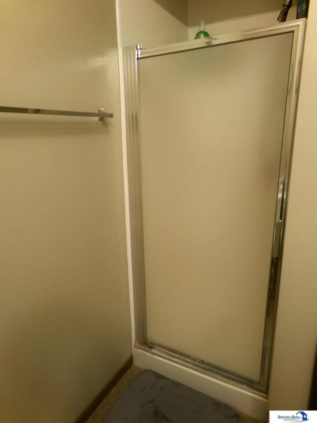 1304 S 4th Ave, Beatrice, NE 68310 - full bathroom with a stall shower and baseboards