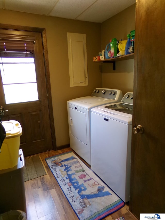 1304 S 4th Ave, Beatrice, NE 68310 - laundry area featuring separate washer and dryer, light wood-style flooring, and electric panel