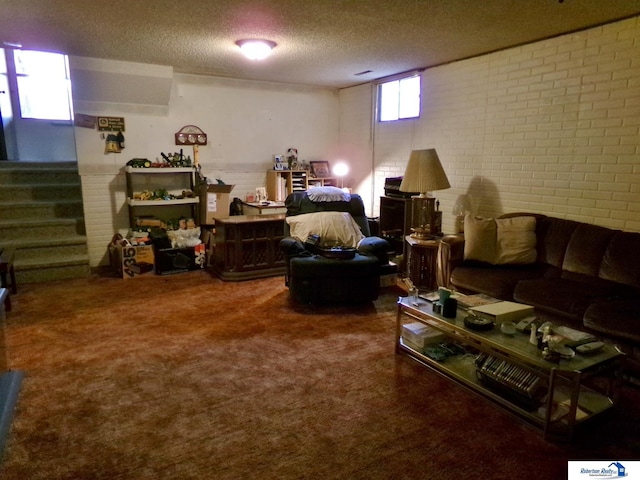1304 S 4th Ave, Beatrice, NE 68310 - living room with a textured ceiling, stairway, carpet flooring, and brick wall