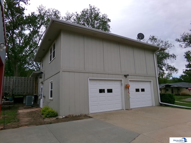 1304 S 4th Ave, Beatrice, NE 68310 - garage with central AC unit and driveway