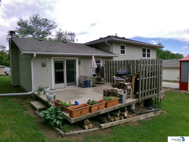 1304 S 4th Ave, Beatrice, NE 68310 - rear view of property with a patio and a shingled roof