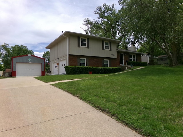 1304 S 4th Ave, Beatrice, NE 68310 - tri-level home featuring a front lawn, a detached garage, brick siding, and a chimney