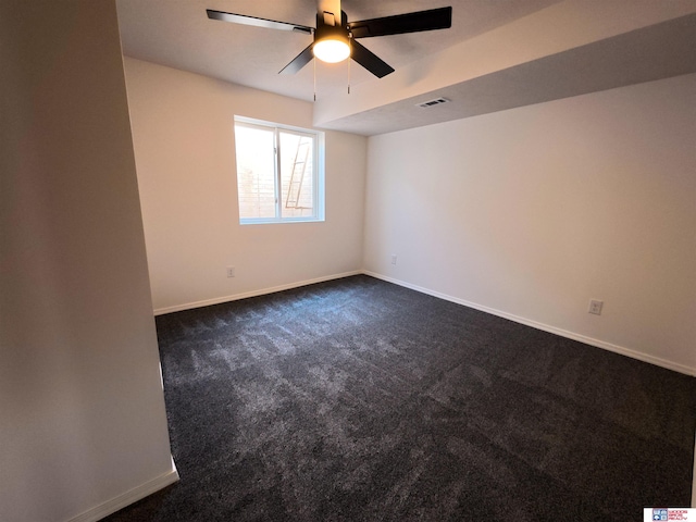 427 11th St, Eagle, NE 68347 - unfurnished room with baseboards, a ceiling fan, and dark colored carpet