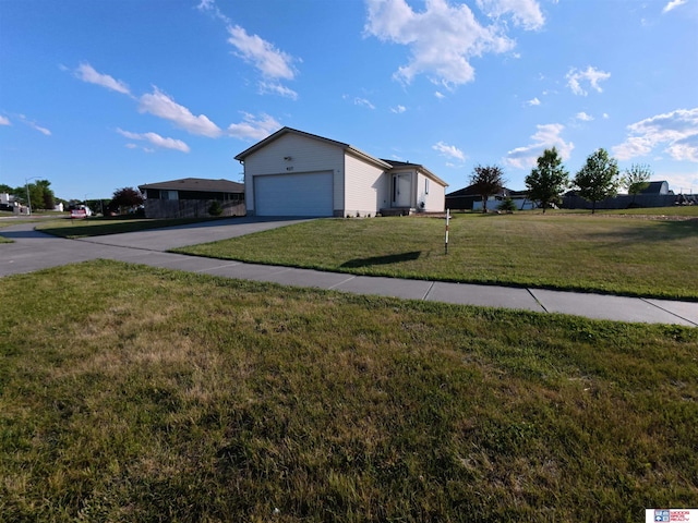 427 11th St, Eagle, NE 68347 - view of property exterior featuring driveway, a lawn, and an attached garage