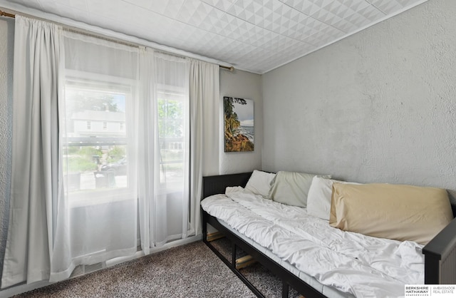 1409 S 17th St, Omaha, NE 68108 - sitting room with carpet floors and a textured wall