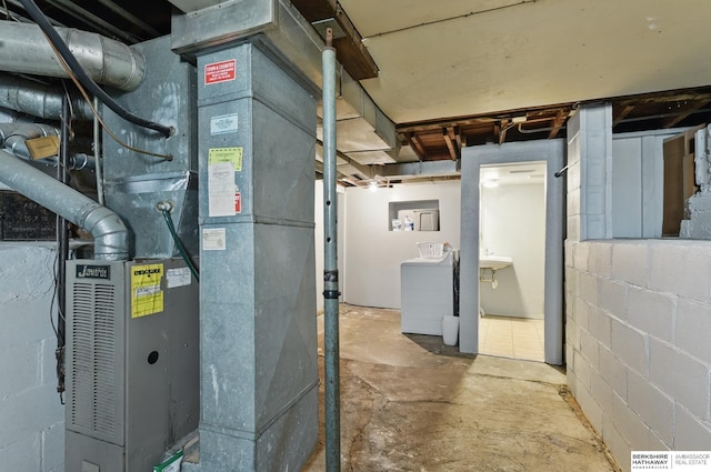 1409 S 17th St, Omaha, NE 68108 - utilities with heating unit and washer / dryer
