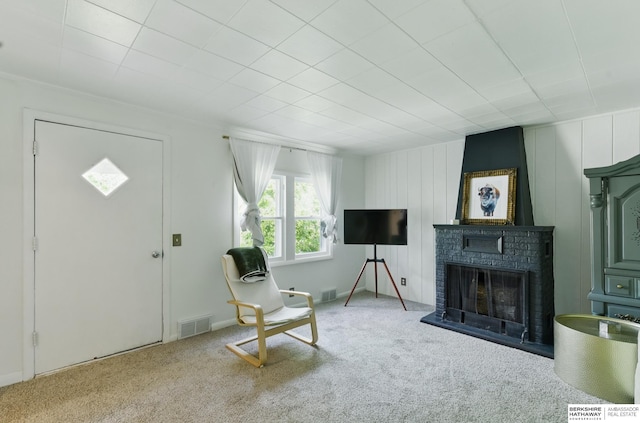 1409 S 17th St, Omaha, NE 68108 - living area with carpet and a brick fireplace