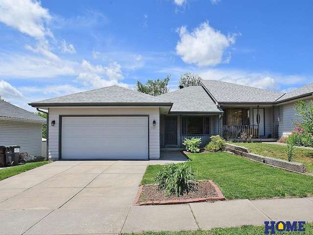 3231 Mickaela Ln, Lincoln, NE 68521 - ranch-style home featuring driveway, a front lawn, a garage, and a porch