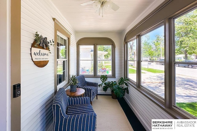 3120 N 205th St, Omaha, NE 68022 - sunroom / solarium with healthy amount of natural light, ceiling fan, and wooden walls