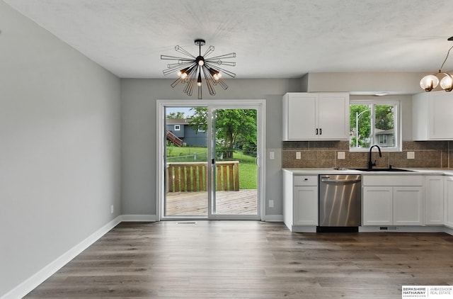 12956 Grand Ave, Omaha, NE 68164 - kitchen with dishwasher, a chandelier, backsplash, and white cabinetry