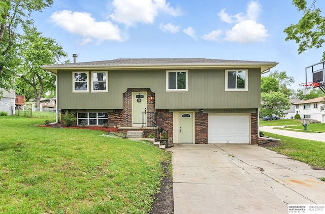 12956 Grand Ave, Omaha, NE 68164 - bi-level home featuring a garage, concrete driveway, and brick siding