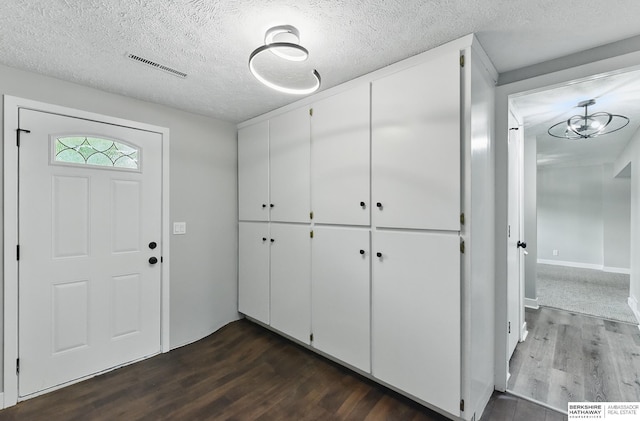 12956 Grand Ave, Omaha, NE 68164 - foyer with dark wood finished floors and a textured ceiling