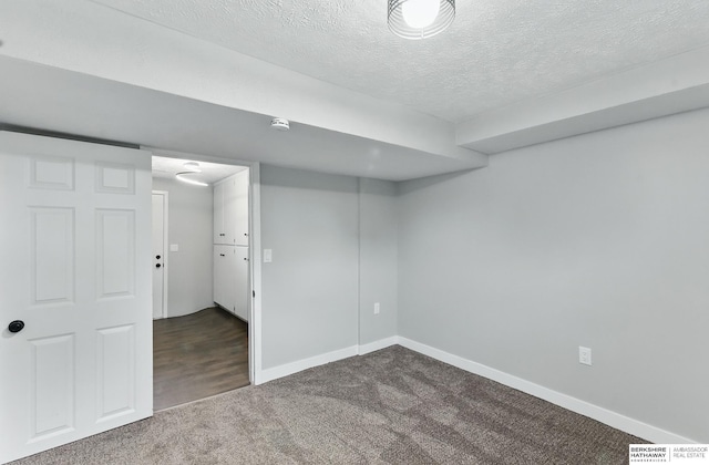 12956 Grand Ave, Omaha, NE 68164 - finished basement with dark carpet, a textured ceiling, and baseboards