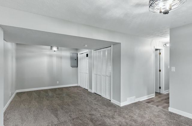 12956 Grand Ave, Omaha, NE 68164 - carpeted spare room featuring baseboards, electric panel, and a textured ceiling