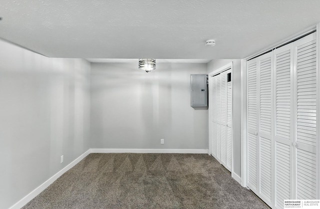 12956 Grand Ave, Omaha, NE 68164 - unfurnished dining area featuring carpet floors, electric panel, baseboards, and a textured ceiling