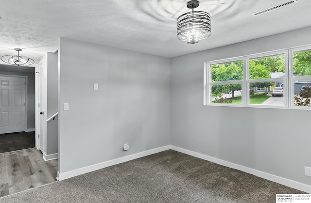 12956 Grand Ave, Omaha, NE 68164 - carpeted spare room with healthy amount of natural light, baseboards, and a chandelier