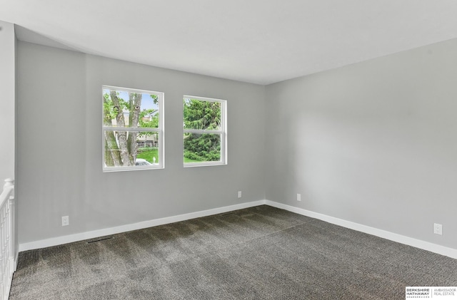 12956 Grand Ave, Omaha, NE 68164 - unfurnished room featuring baseboards and dark colored carpet