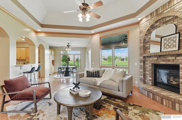 211 Longwood Dr, Papillion, NE 68133 - living area with ceiling fan, light wood finished floors, a fireplace, ornamental molding, and recessed lighting