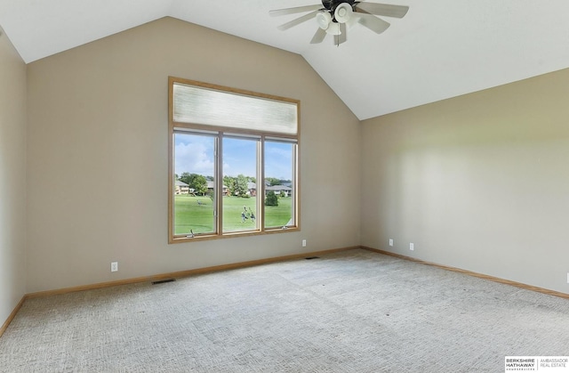 211 Longwood Dr, Papillion, NE 68133 - spare room featuring lofted ceiling, ceiling fan, carpet, and baseboards