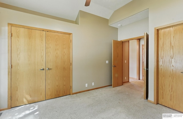 211 Longwood Dr, Papillion, NE 68133 - unfurnished bedroom featuring carpet, vaulted ceiling, baseboards, and ceiling fan