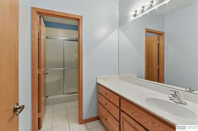 211 Longwood Dr, Papillion, NE 68133 - bathroom featuring vanity, a shower with door, and tile patterned floors