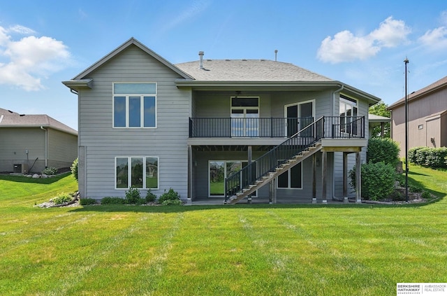 211 Longwood Dr, Papillion, NE 68133 - rear view of property featuring stairway, a yard, and a wooden deck