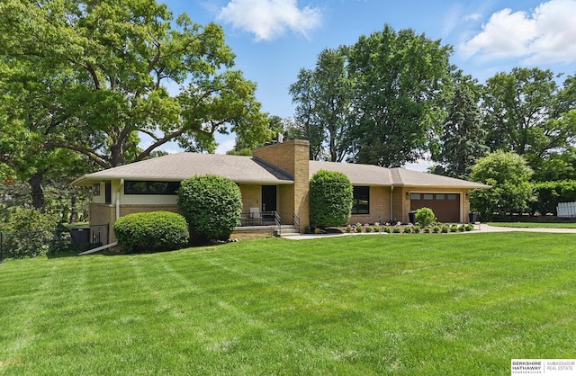 317 N 96th St, Omaha, NE 68114 - view of front of property with a garage, a chimney, and a front lawn