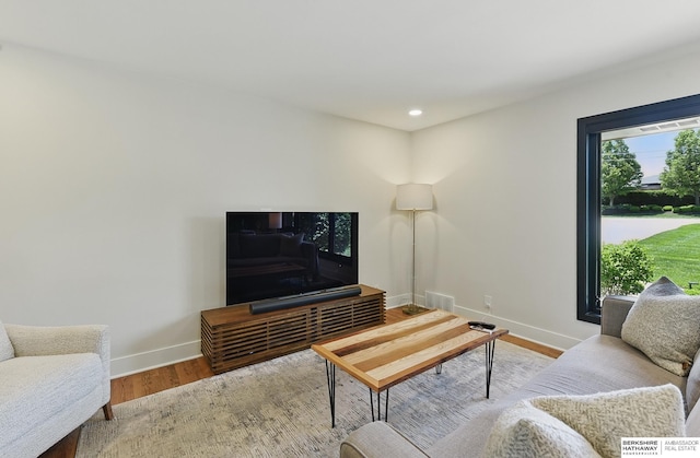 317 N 96th St, Omaha, NE 68114 - living area featuring baseboards, wood finished floors, and recessed lighting
