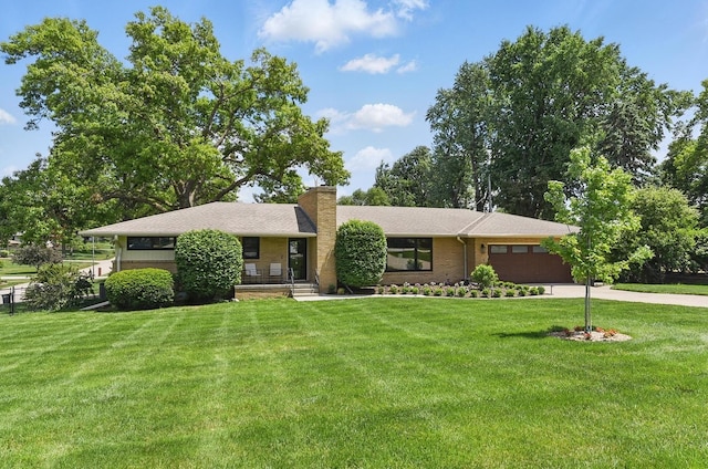 317 N 96th St, Omaha, NE 68114 - view of front of home with an attached garage, a chimney, a front lawn, and concrete driveway